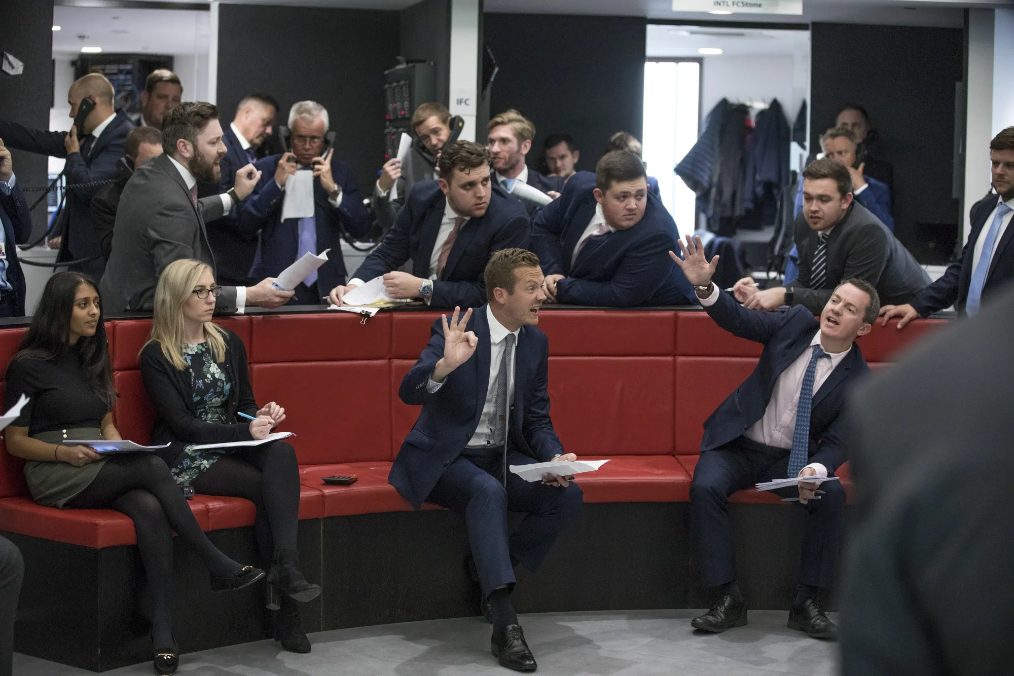 Traders react on the trading floor of the open outcry pit at the London Metal Exchange Ltd.&nbsp;in London.