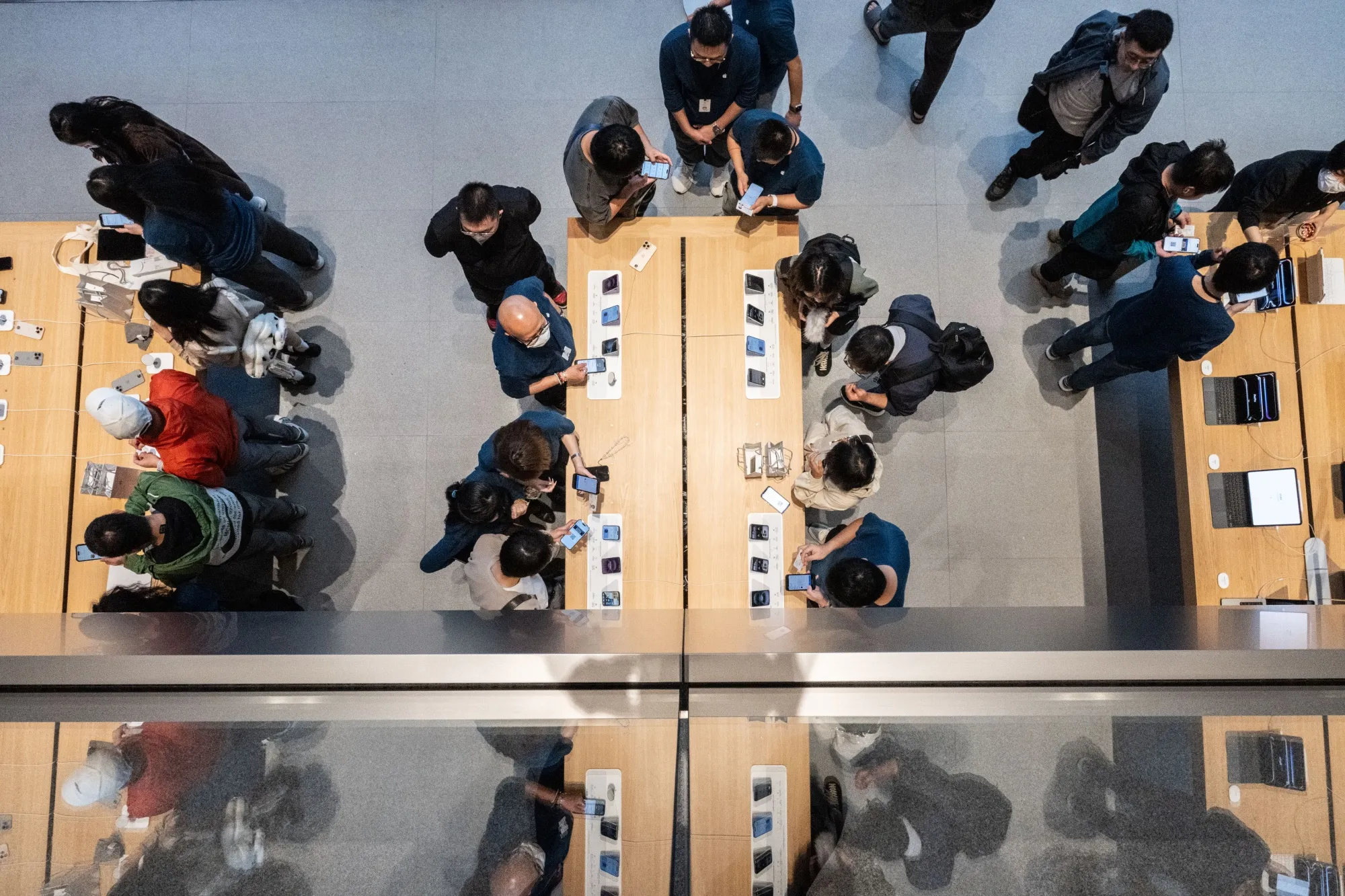Customers at an Apple store in Beijing.