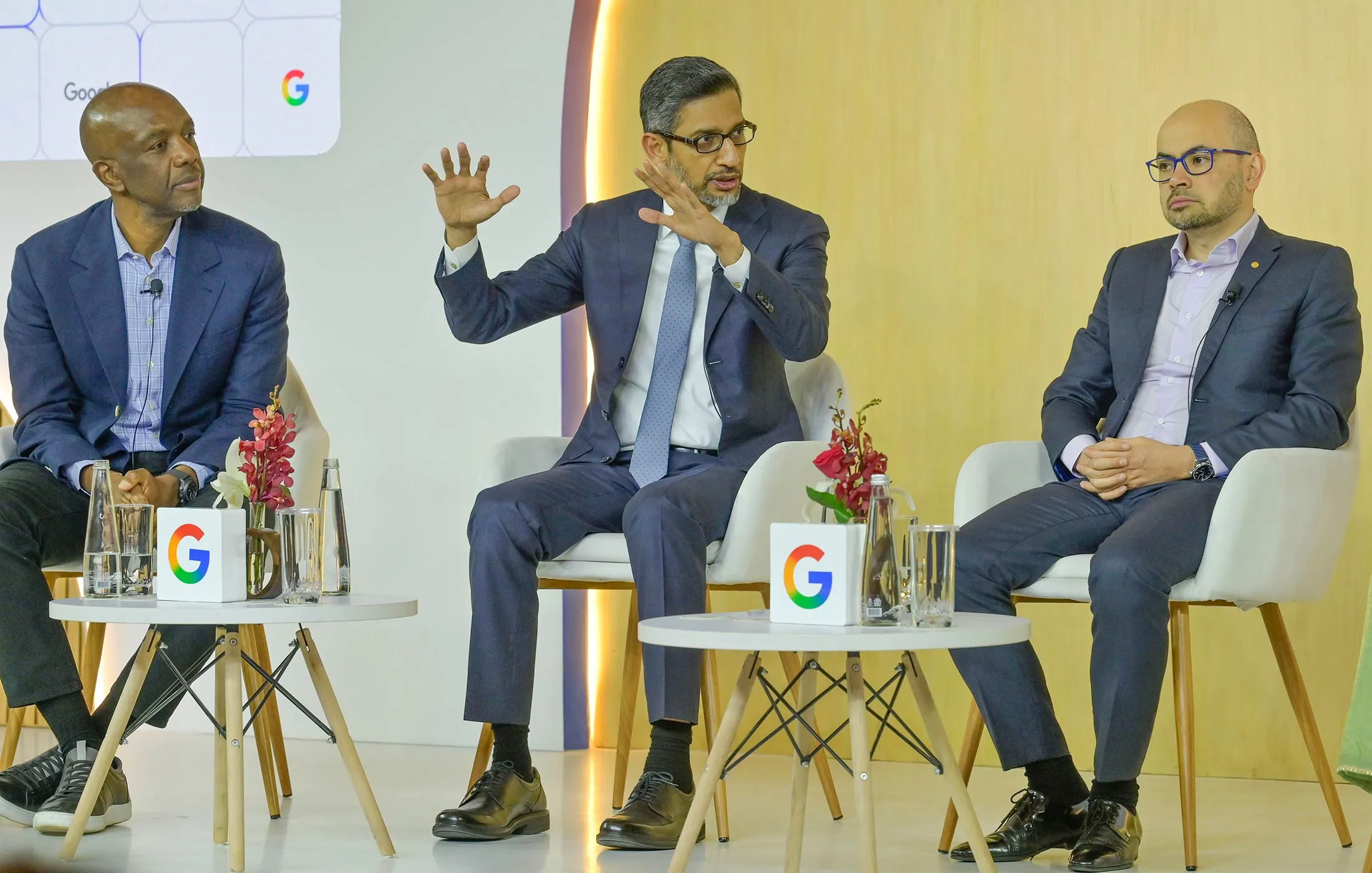 From left: Manyika, Google CEO Sundar Pichai and Hassabis.