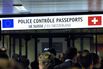passengers at the EU and Swiss passport control desk in the arrivals-hall