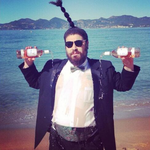 Ostrovsky pouring rosé on himself at 7 a.m. during the Cannes Film Festival. Because he can.