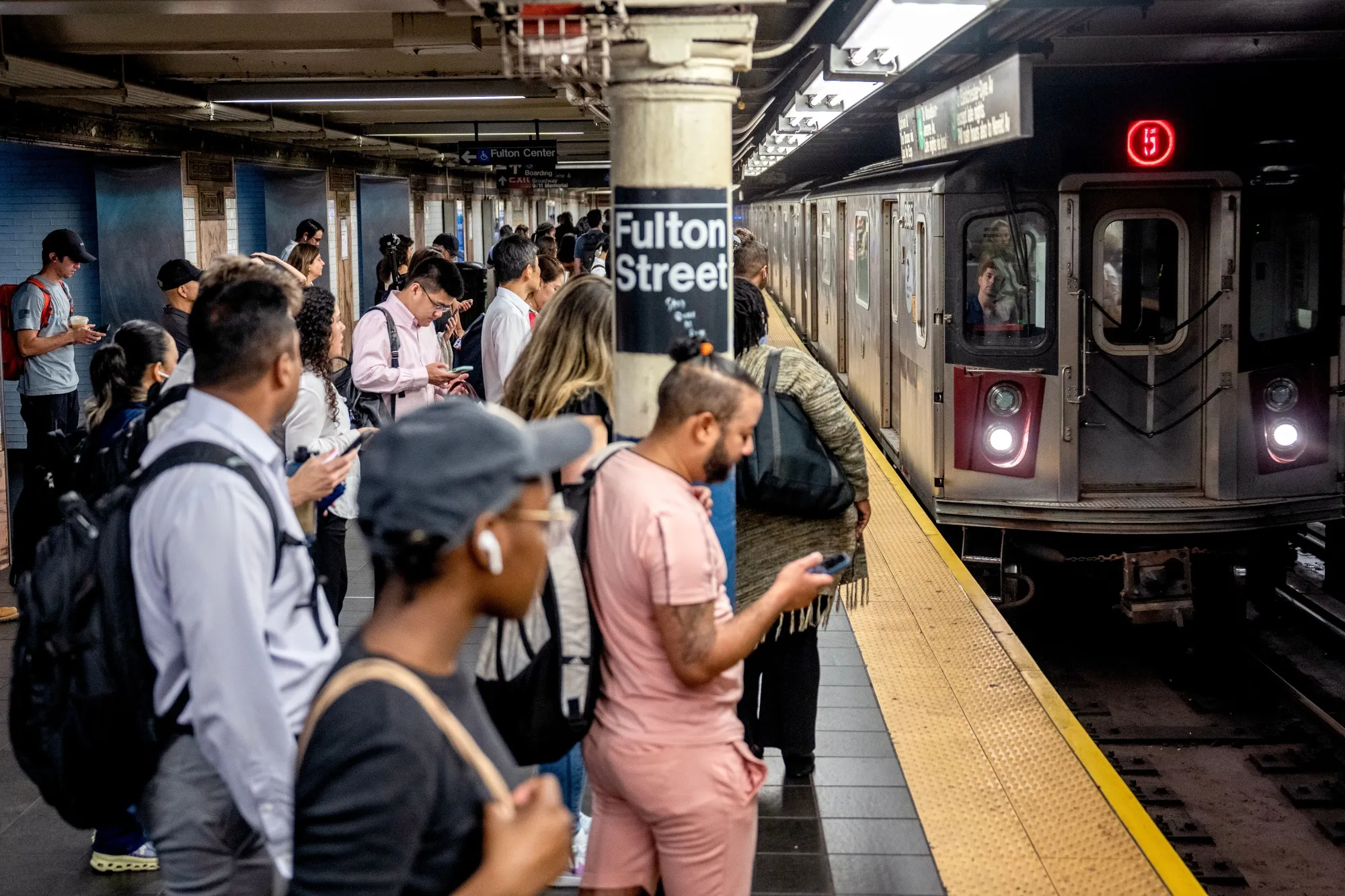 Commuters taking the subway run by the MTA at Fulton Street&nbsp;in New York.