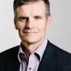 Headshot of Dennis M Woodside