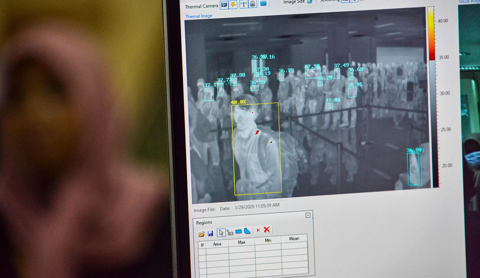 A thermal imaging machine scans passengers at the Sultan Iskandar Muda International Airport in Blang Bintang, Indonesia on Jan. 29.