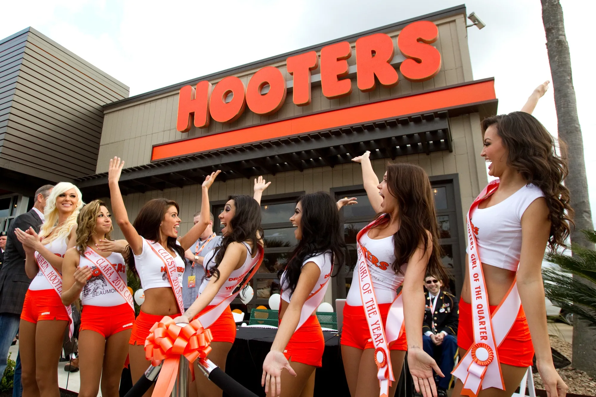 A line of Hooters Girls outside the company’s restaurant in Houston in 2013.