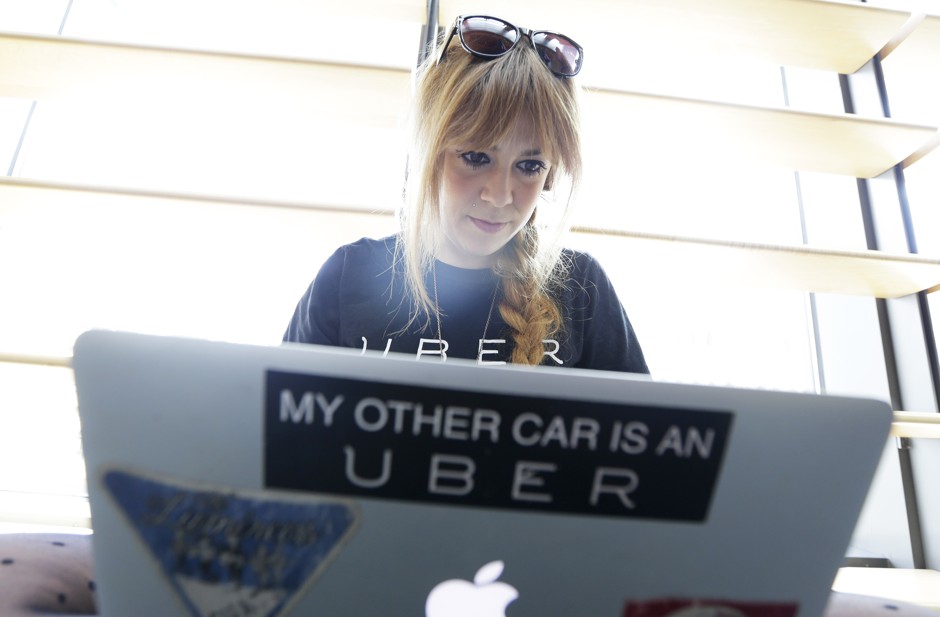 Jen Joyce, a community manager for Uber, works on a laptop.
