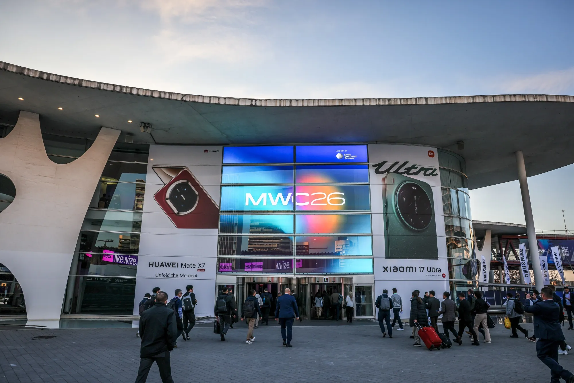 Attendees arrive on the opening day of MWC Barcelona 2026 in Barcelona, on March 2.