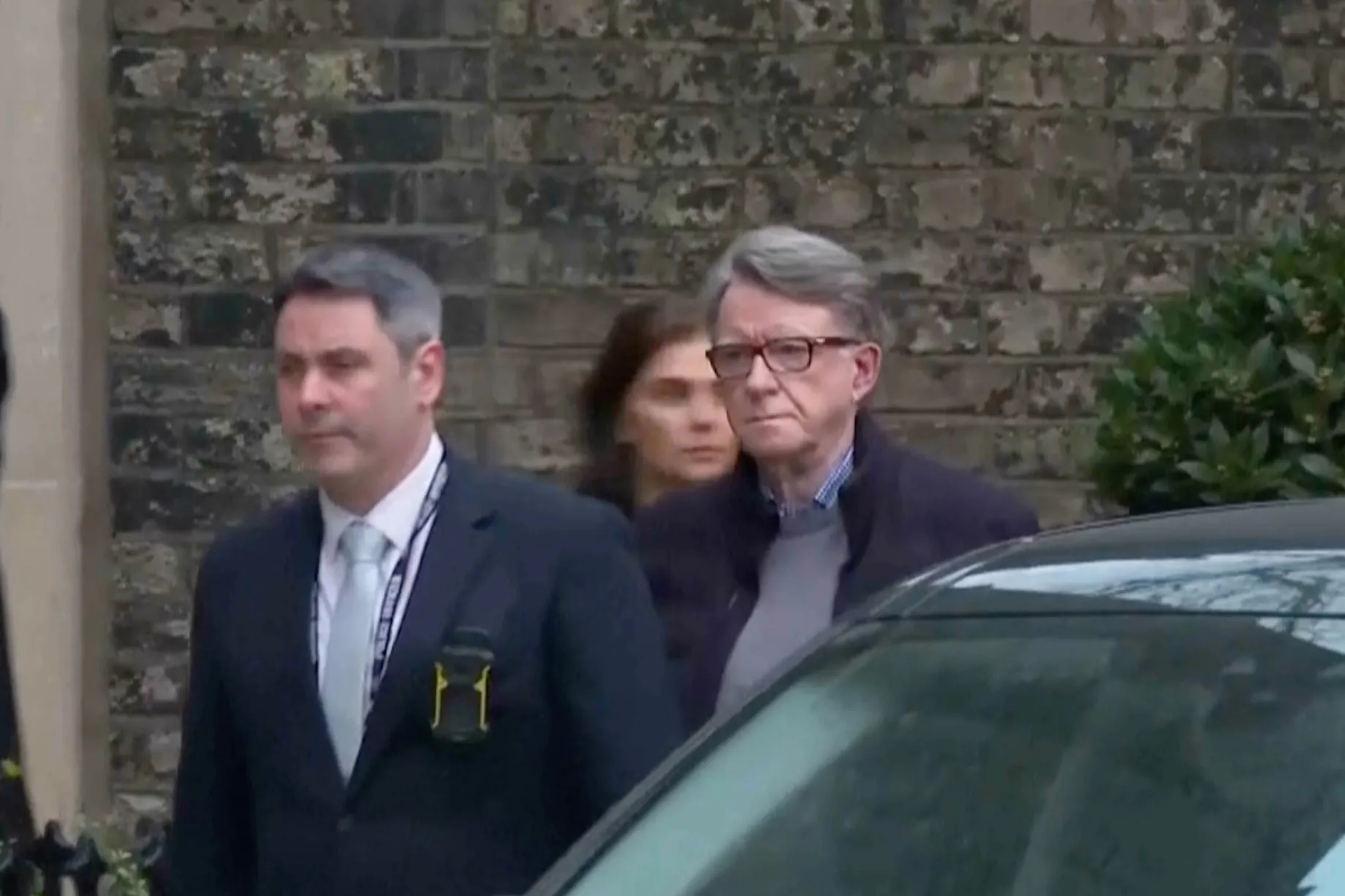Peter Mandelson is escorted from a property in London, on Feb. 23.