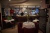 Hugues Gournay, Chef Patron of Le Saotico, stands behind the bar of his restaurant while waiting for take-away orders in Paris on Feb. 1. 
