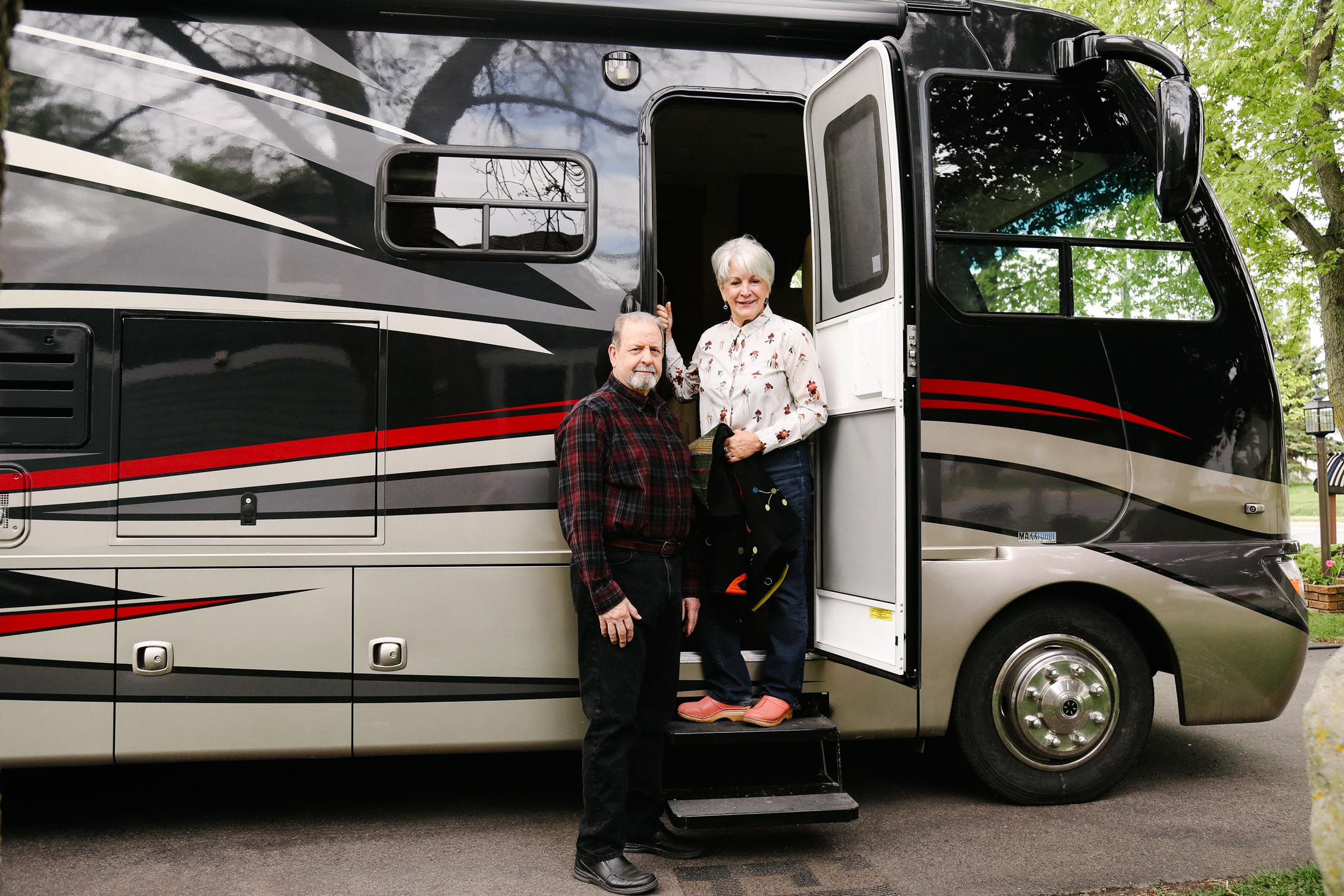 Jeff and Pam Sandberg pose with their new RV from Hilltop Camper and RV in St. Paul, Minnesota, May 20, 2020.