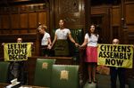Extinction Rebellion protesters at the Speaker's chair in the House of Commons chamber, on Sept. 2.