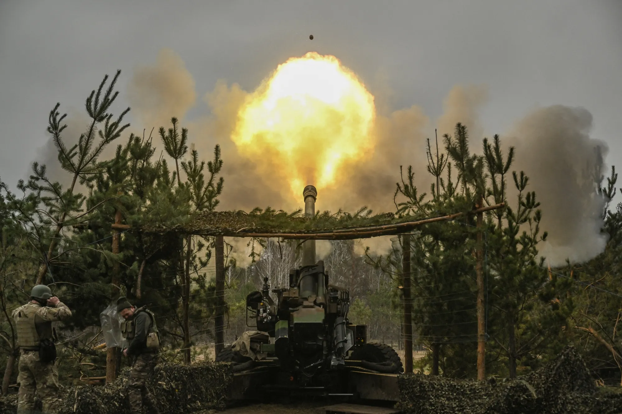 Ukrainian servicemen fire with a TRF-1 155mm at Russian positions on March 27.