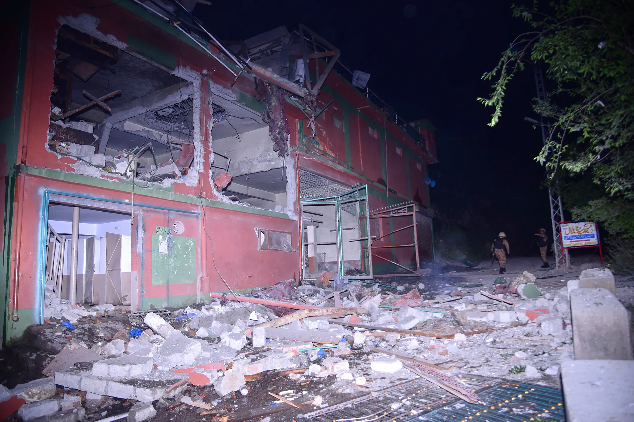 Army soldiers examine a building damaged by a suspected Indian missile attack near Muzaffarabad, the capital of Pakistan controlled Kashmir, on, May 7.