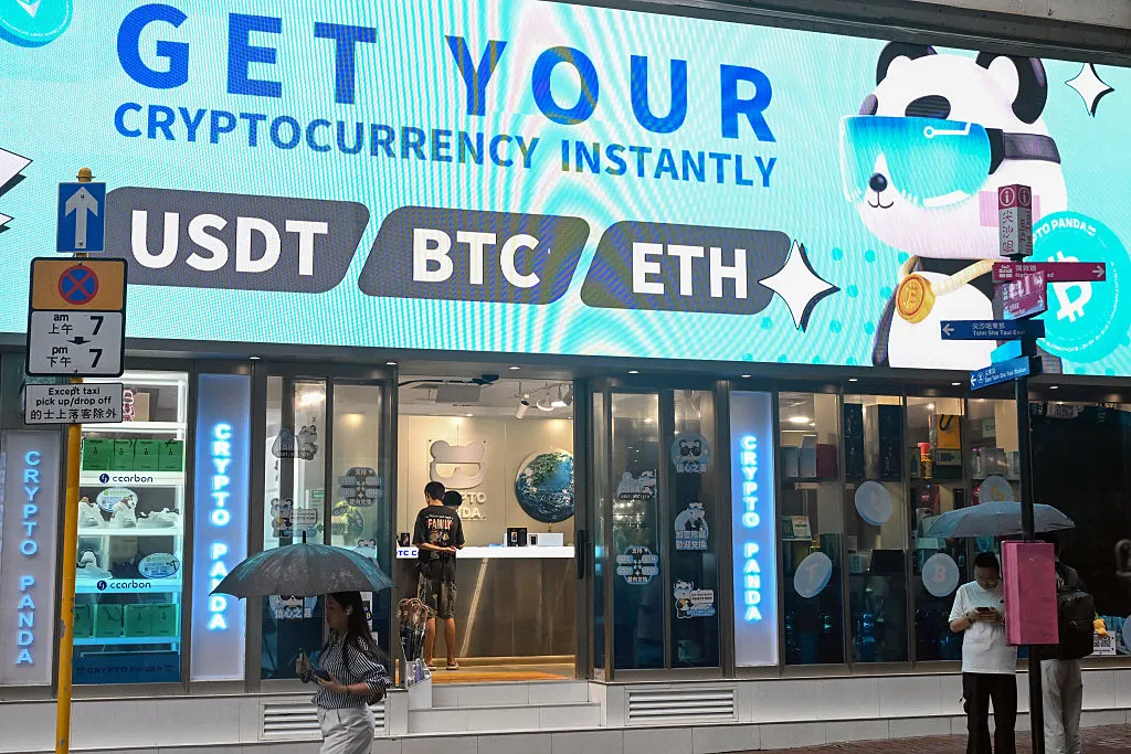 Bitcoin, ethereum and the stablecoin USDT promoted at a cryptocurrency store.&nbsp;
