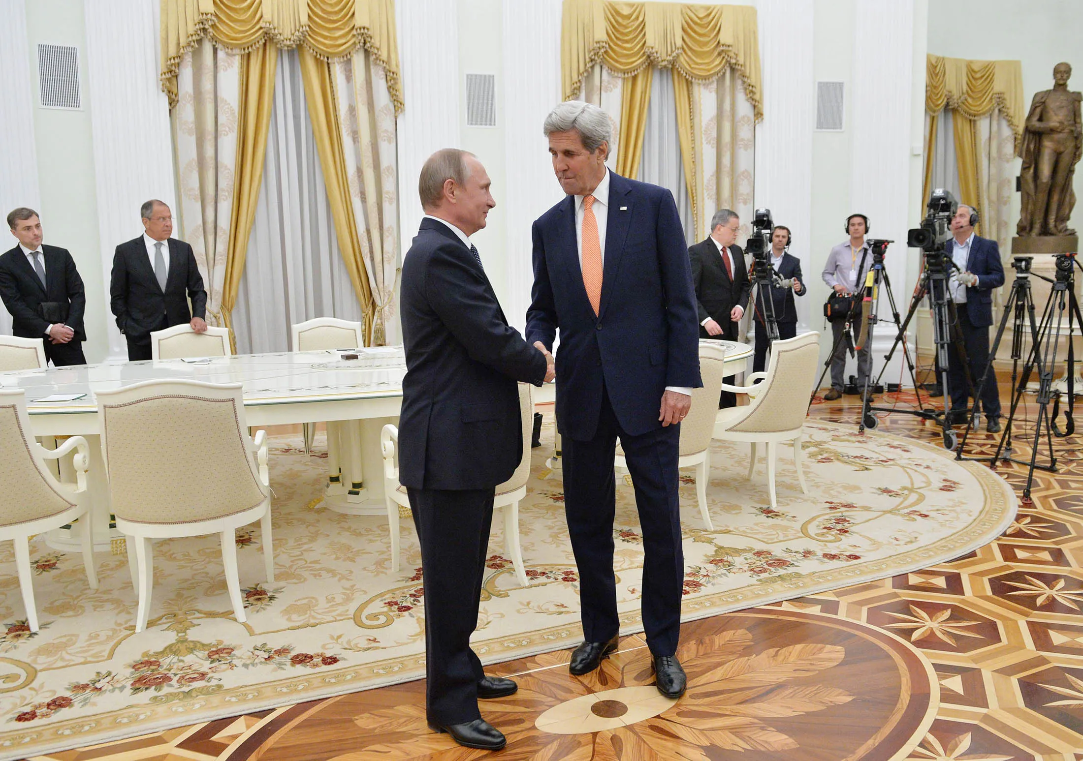 Vladimir Putin and John Kerry shake hands during a meeting at Moscow's Kremlin on July 14.
