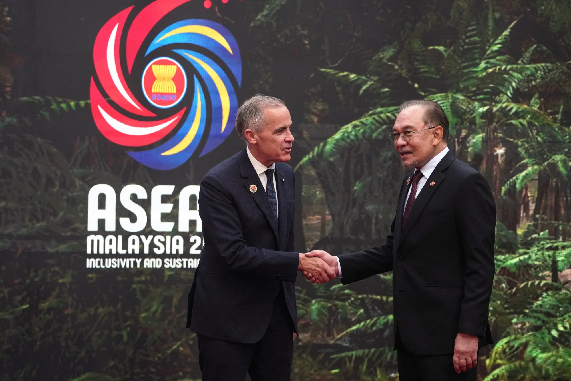 Canadian Prime Minister Mark Carney, left, and Malaysian Prime Minister Anwar Ibrahim during the Association of Southeast Asian Nations summit in Kuala Lumpur on Oct. 26. Canadian Prime Minister Mark Carney, left, and Malaysian Prime Minister Anwar Ibrahim during the Association of Southeast Asian Nations summit in Kuala Lumpur on Oct. 26.