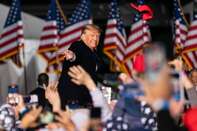 Former President Donald Trump Holds Rally In Support Of David Perdue And Herschel Walker