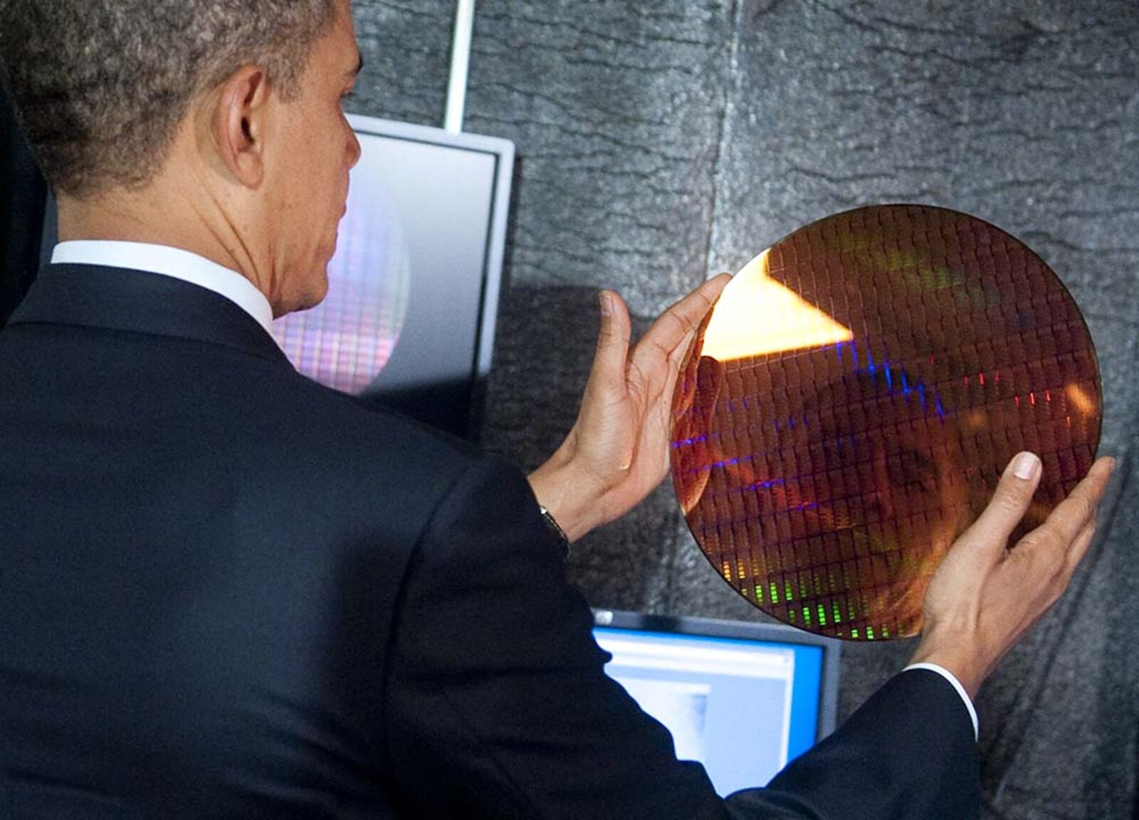 US President Barack Obama looks at his r