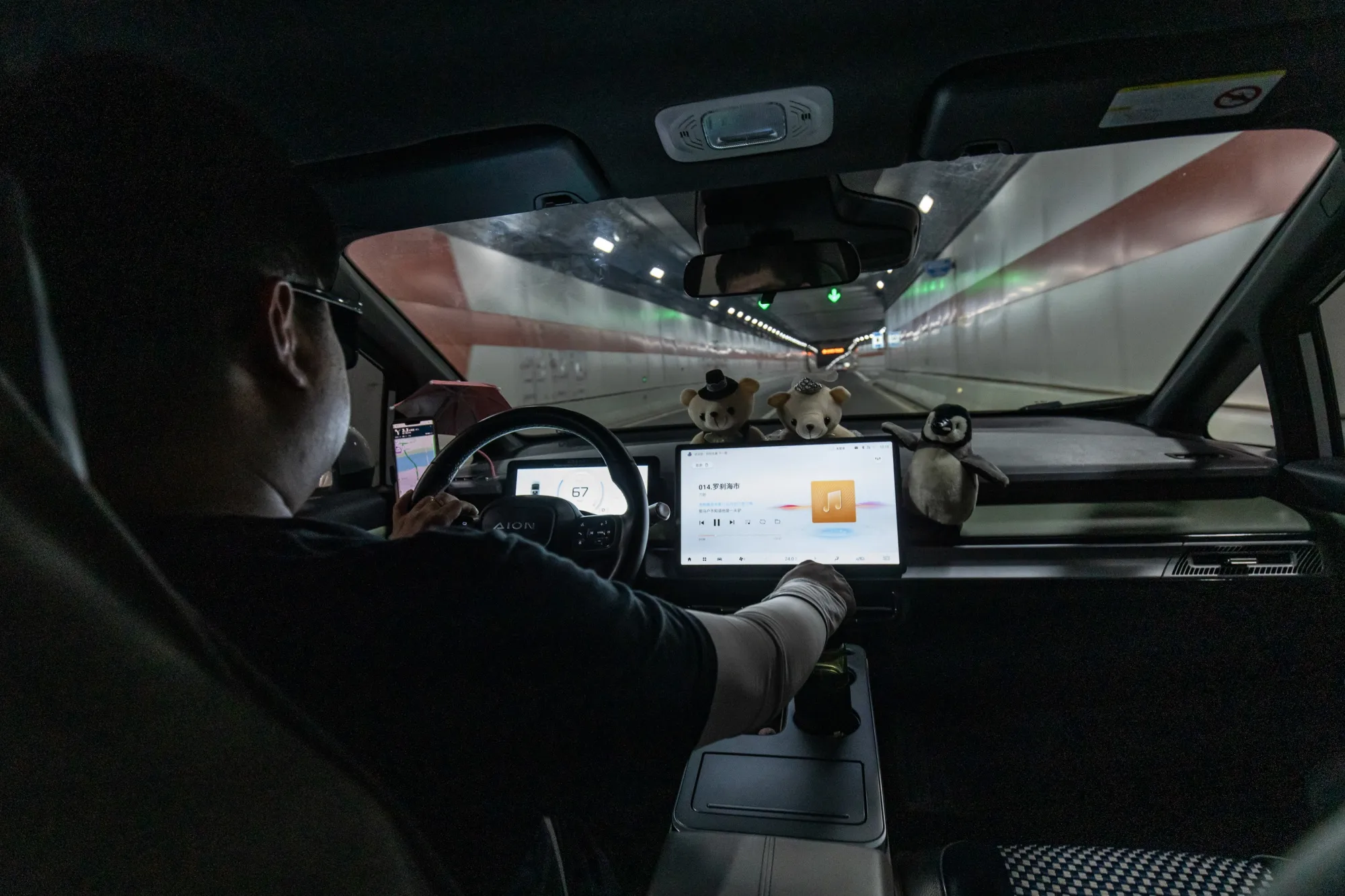 A ride-hailing driver operating&nbsp;his vehicle in Wuhan, China, in July.