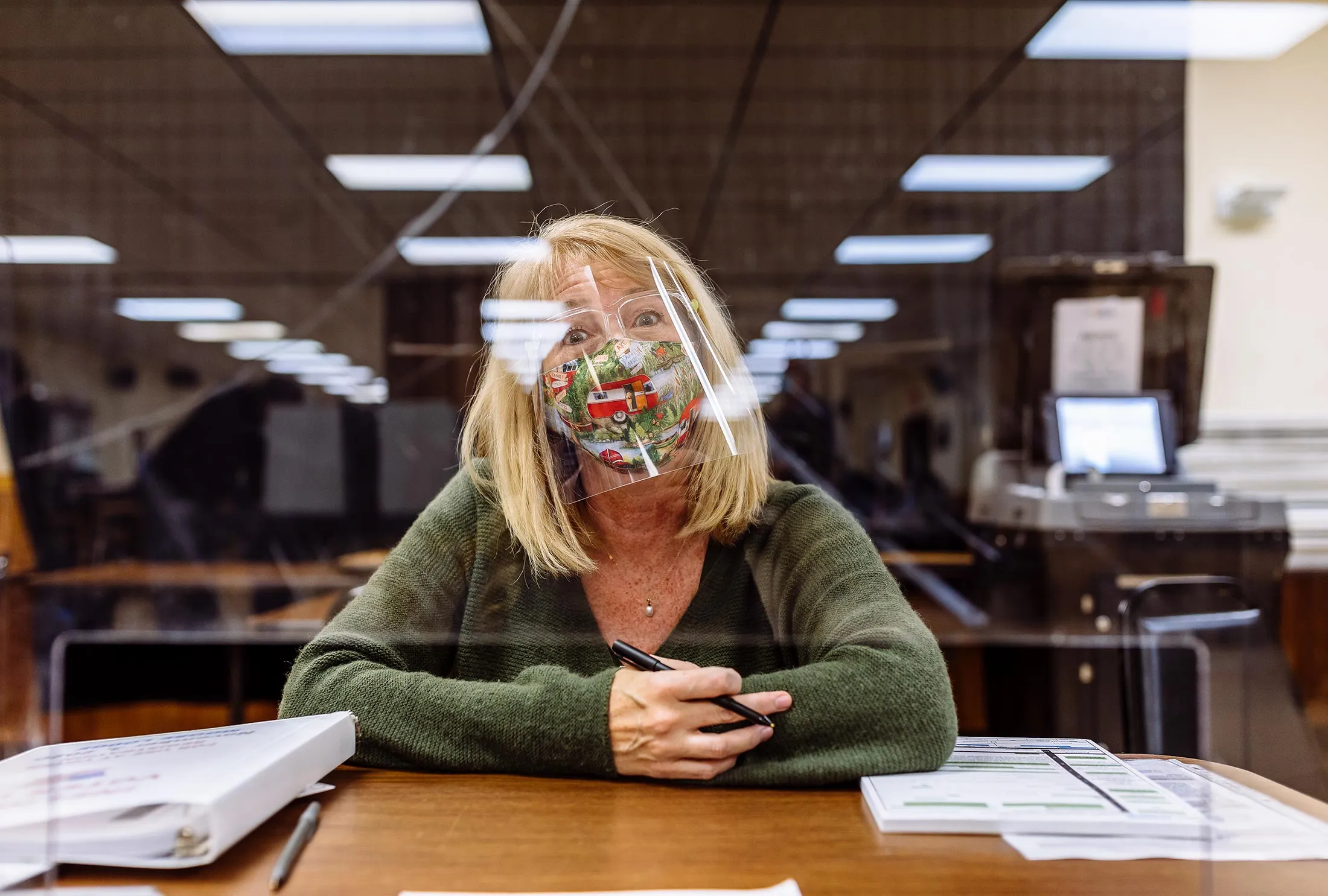 At a Moose Lodge in Kenosha, Wis., Ann Mingilino works a voter registration table.