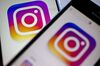 Facebook Inc.'s Instagram logo is displayed on the Instagram application on an Apple Inc. iPhone in this arranged photograph taken in Washington, D.C., U.S., on Friday, June 17, 2016. In a bid to give its users an incentive to create more content for the photo and video-sharing site, Facebook's Instagram is considering sharing revenue generated from news, sports, celebrities and other content said Carolyn Everson, vice president for global marketing solutions at Facebook.