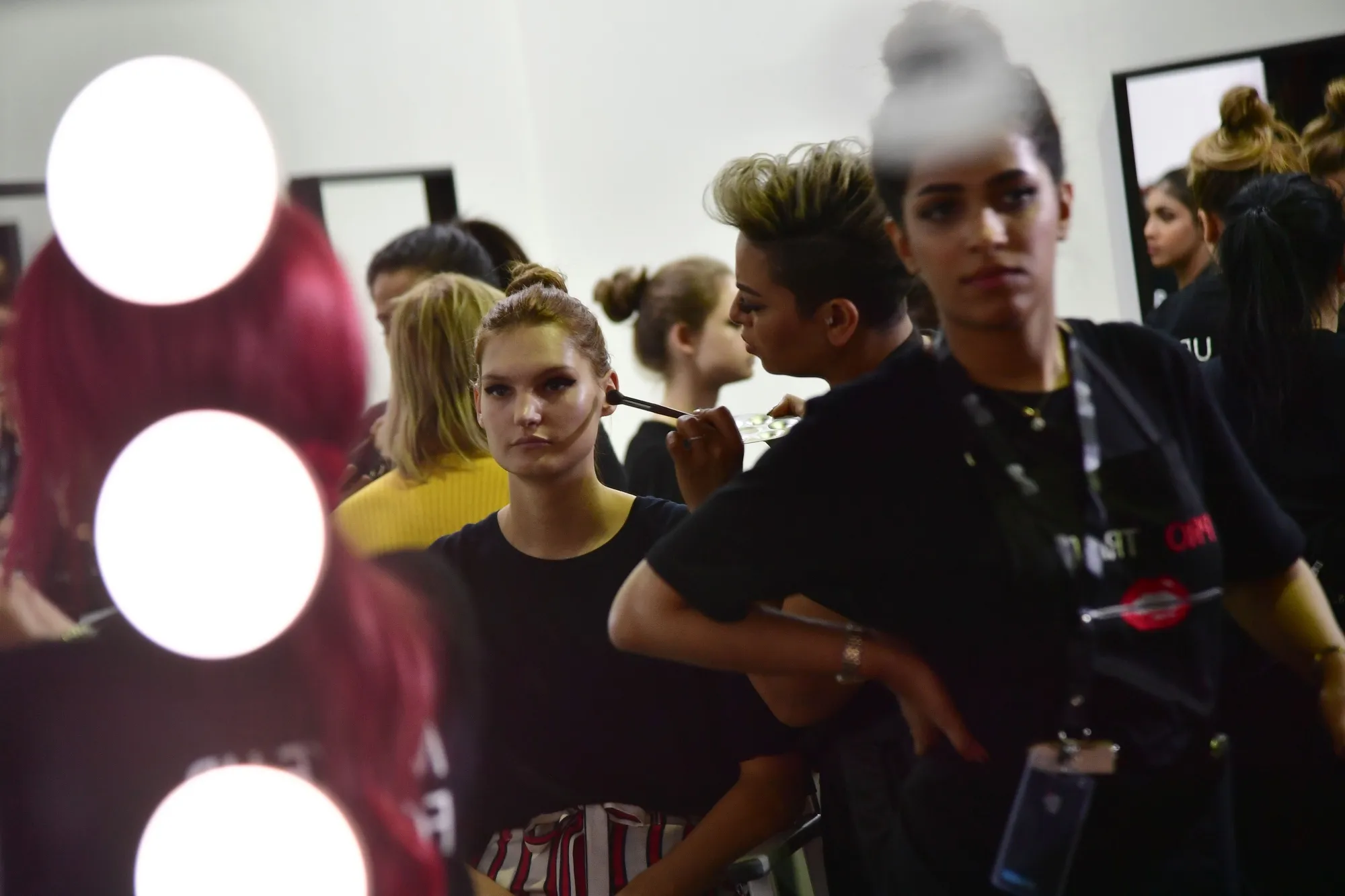 A Saudi makeup artist preps a model backstage during the first Arab Fashion Week in Riyadh.