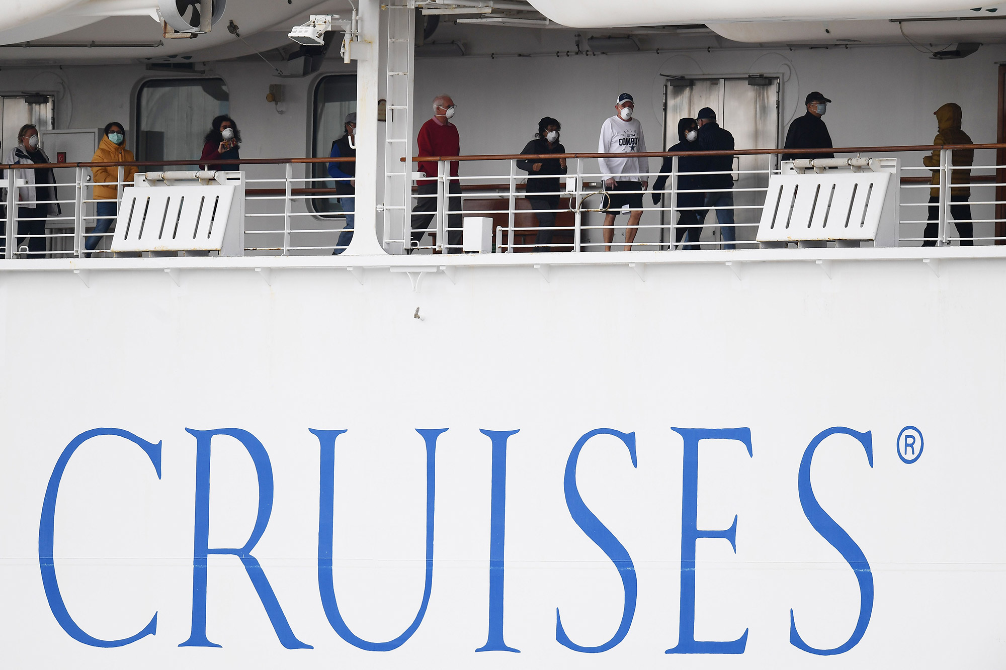 Passengers walk along the deck of the Diamond Princess cruise ship in Yokohama on Feb.&nbsp;14.&nbsp;
