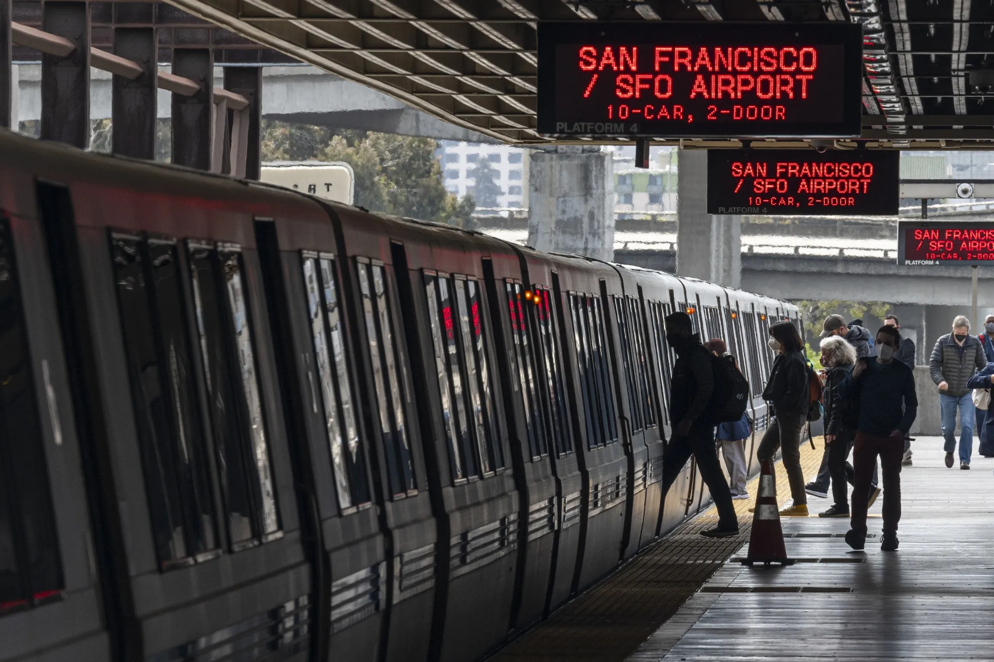 Commuters board a Bay Area Rapid Transit train at the MacArther station in Oakland, California on&nbsp;March 4.