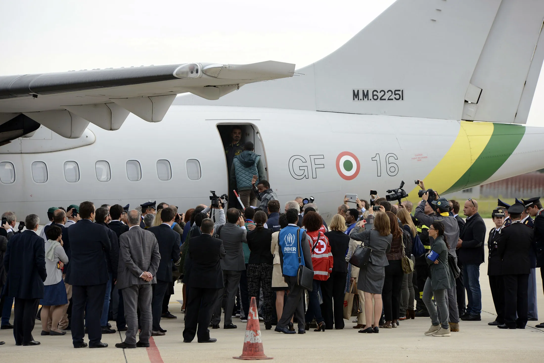 Eritrean refugees board a plane heading for Sweden at Ciampino airport in Rome.
