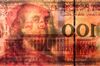 A Chinese one-hundred yuan banknote is placed in front of a U.S. one hundred dollar banknote in an arranged photograph in Hong Kong, China, on Monday, April 15, 2019. China's holdings of Treasury securities rose for a third month as the Asian nation took on more U.S. government debt amid the trade war between the world’s two biggest economies.