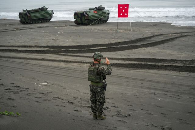 A military personal guides the Taiwan's AAV7 amphibious assault vehicle on a beach during drill to simulate the Chinese People's Liberation Army (PLA) landing on three beaches in Yilan, Taiwan on May 24, 2023