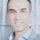 Headshot of Dr Dennis Sarabi