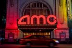 An AMC movie theater at night in the Times Square neighborhood of New York.
