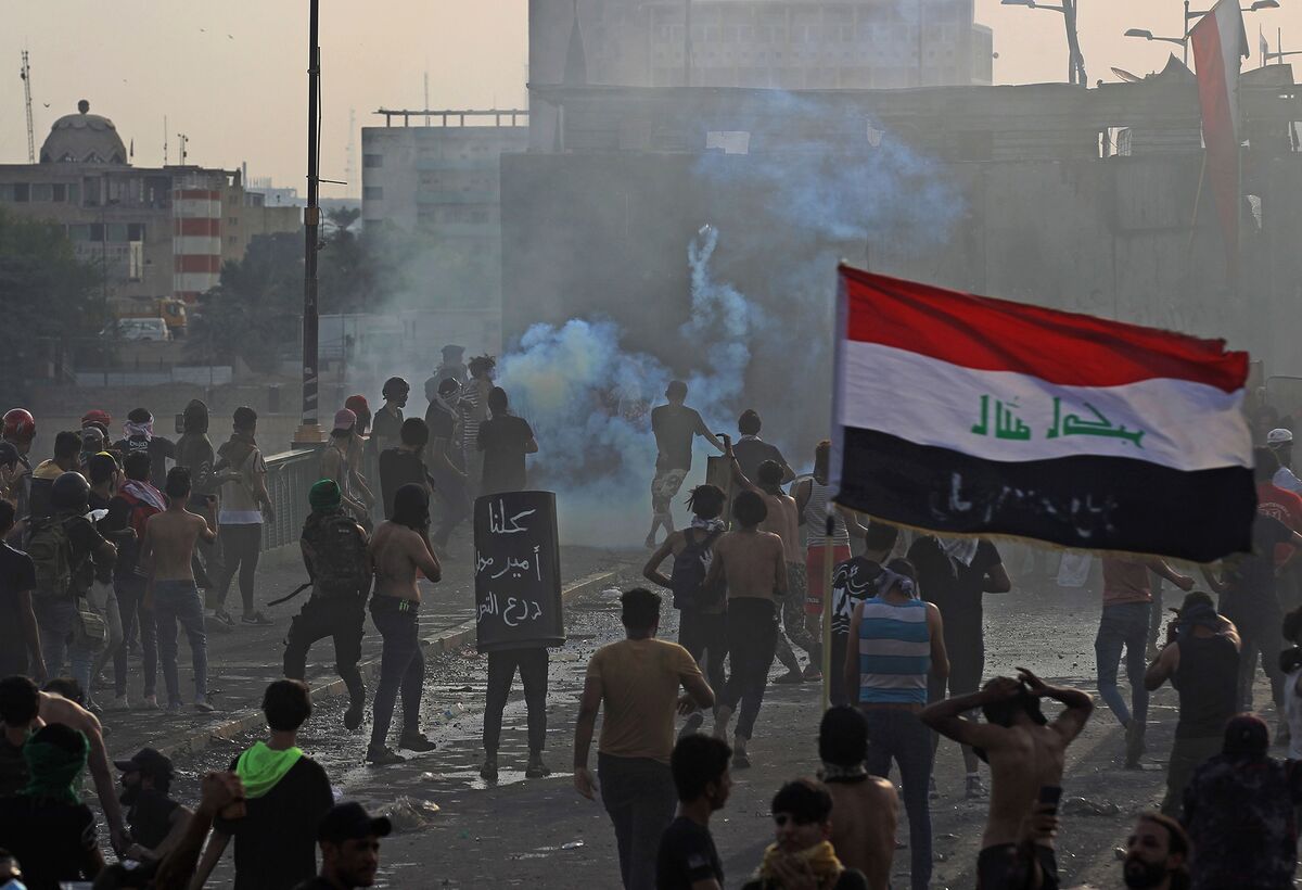 Tear Gas Fired As Thousands Mark One Year Of Iraq Protests - Bloomberg