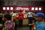 Customers line up to check-out during the grand opening of the new J.C. Penney Co. store in the Brooklyn.