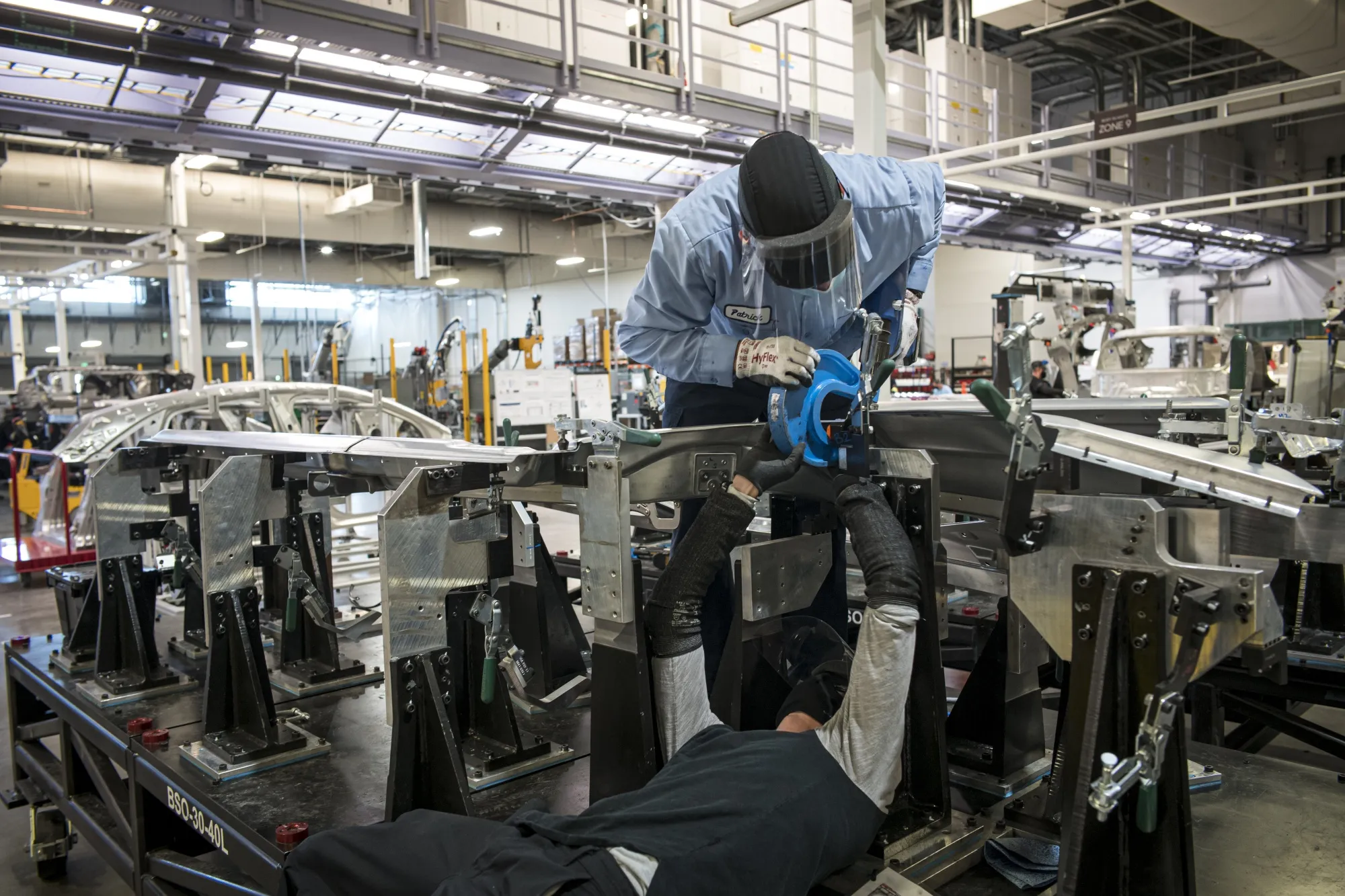 Workers assemble the Lucid Air prototype electric vehicle in 2020.&nbsp;
