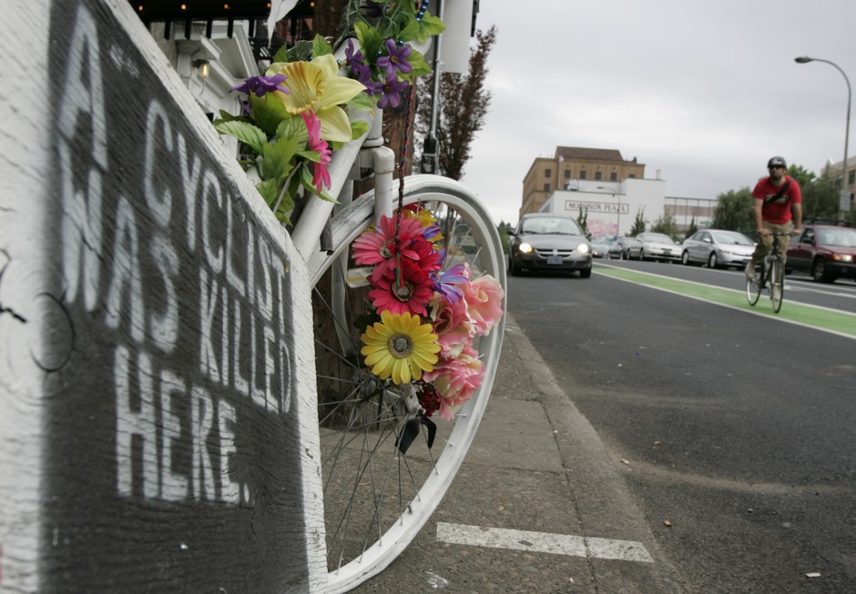 A &quot;ghost bike&quot; memorial marks the spot where a cyclist was killed in 2007 in an accident with a truck in Portland, Oregon.