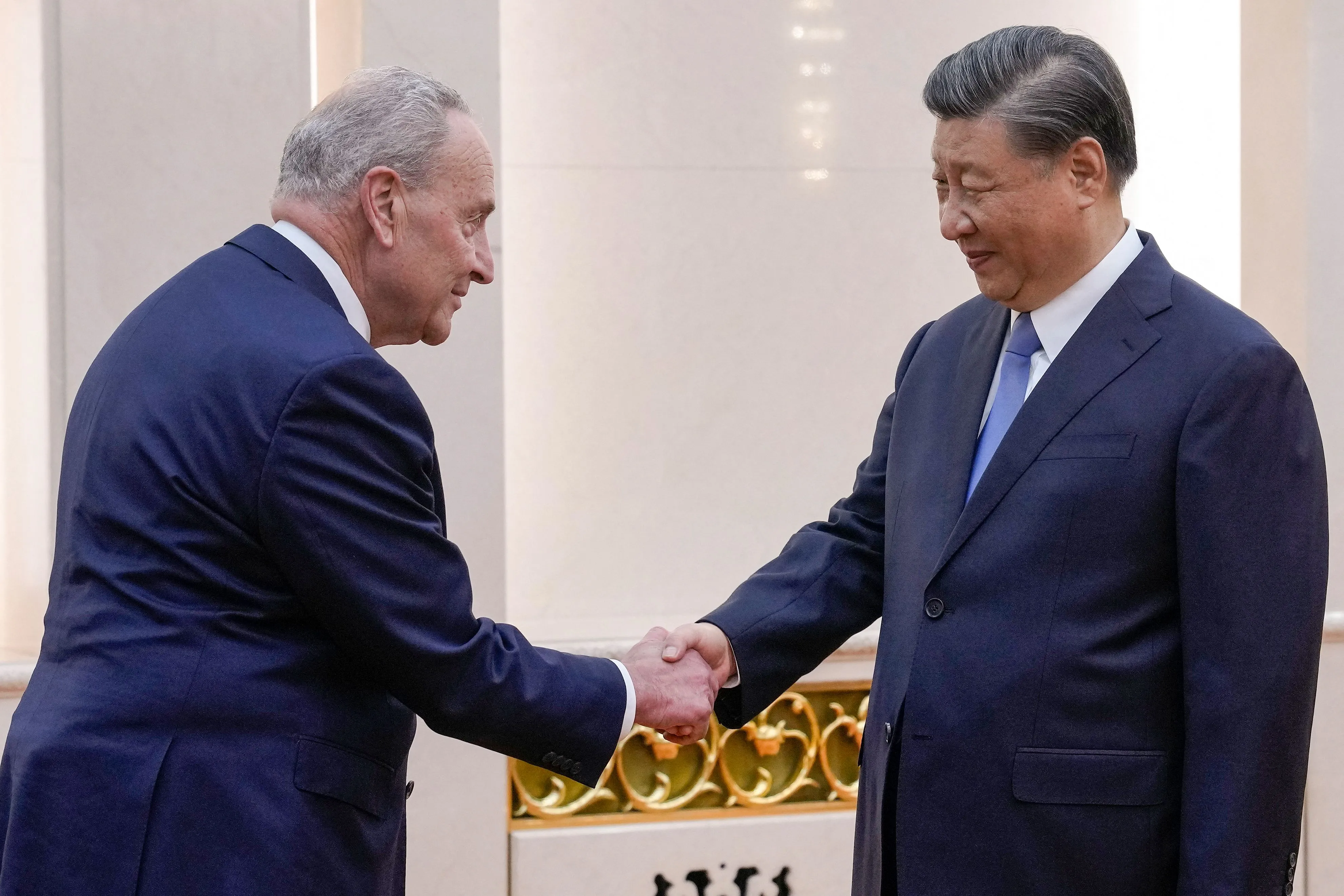 Xi Jinping greets&nbsp;Chuck Schumer&nbsp;at the Great Hall of the People in Beijing on Oct. 9.