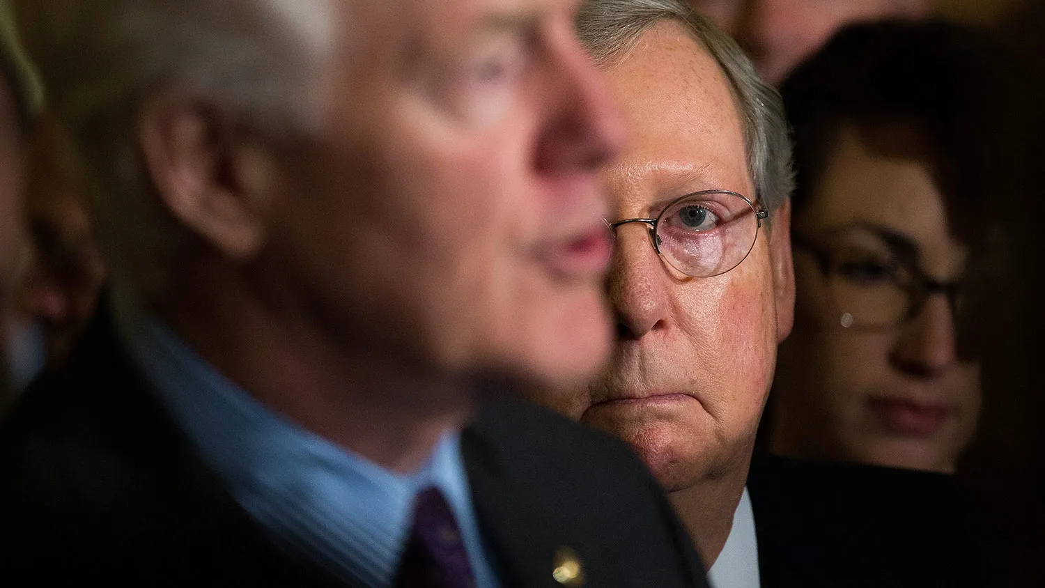 Senator John Cornyn speaks as Senate Majority Leader Mitch McConnell looks on at a news conference on May 10, 2016, in Washington.
