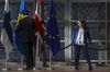 A worker adjust a Swedish national flag ahead of an European Union (EU) leaders summit in Brussels, Belgium, on Thursday, Oct. 17, 2019. Negotiators from the U.K. reached an agreement with officials in Brussels Thursday that could pave the way for Britain to finally break its 46-year-old ties to the European Union this month.