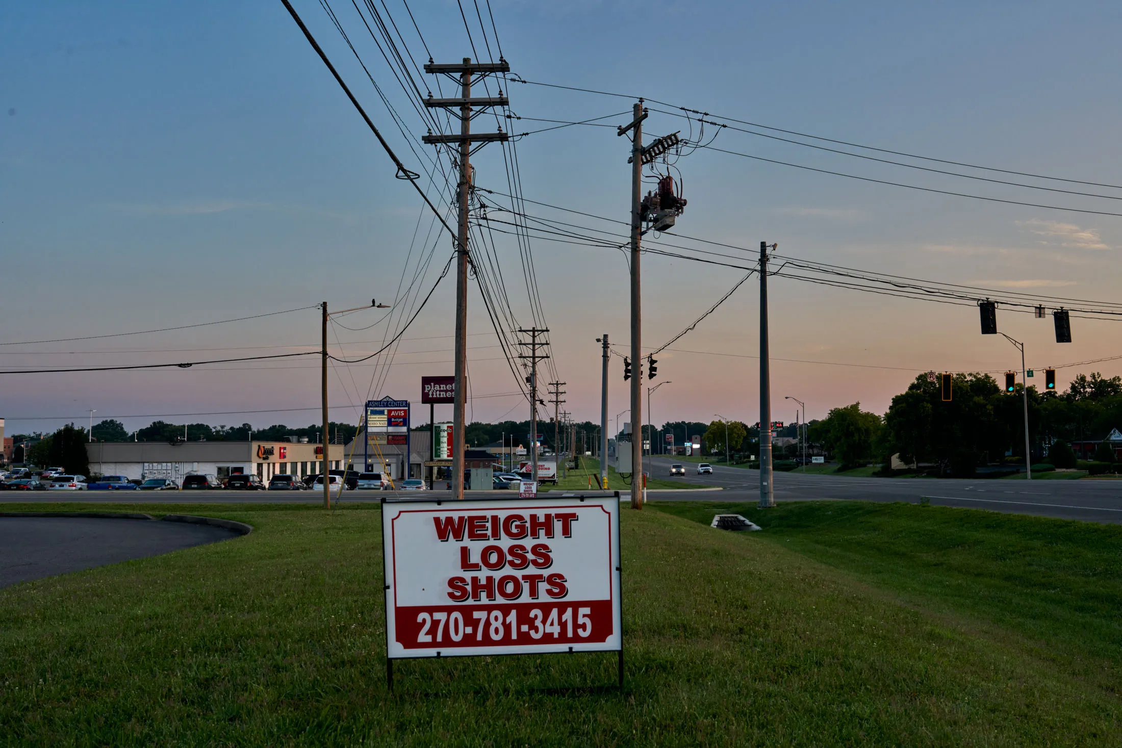 An ad on the side of the road in Bowling Green, Kentucky.