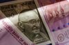 Indian two thousand and five hundred rupee banknotes are arranged for a photograph in Mumbai, India, on Tuesday, Jan. 30, 2018. Indian Prime Minister Narendra Modi has a tough balancing act in this week's budget: maintaining fiscal prudence or handing out cash to placate rural voters ahead of next year's election.