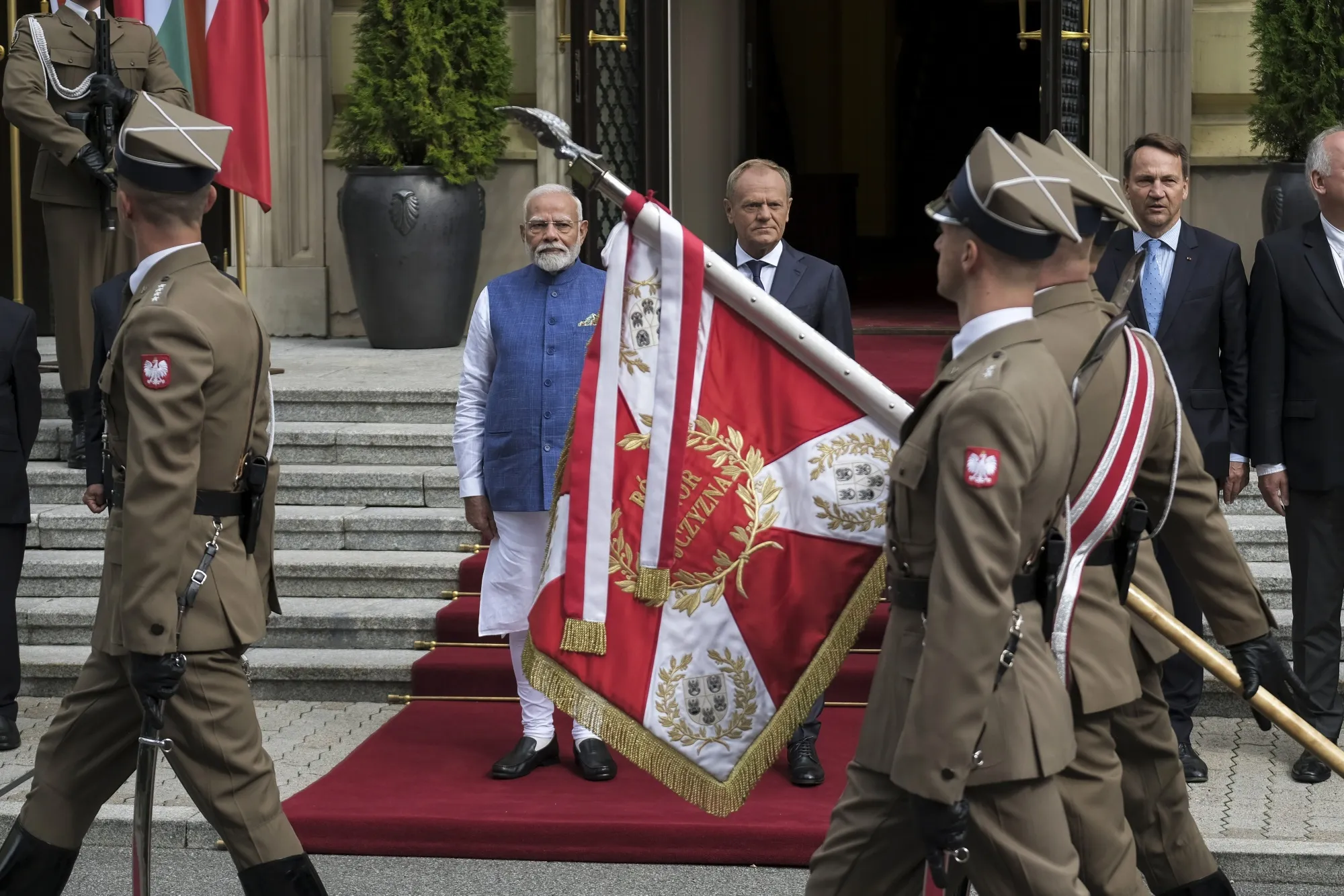 Narendra Modi, left, and Donald Tusk, at an honour guard review in Warsaw, on Aug. 22.