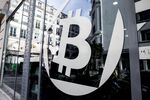 A logo sits on the windows of the offices of La Maison du Bitcoin bank.
