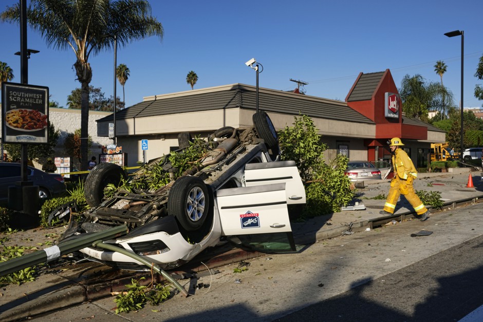 Emergency personnel work at the scene of a car crash near downtown Los Angeles in 2016.