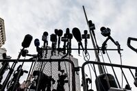 Microphones from news media outlets positioned in front of federal court during the Ghislane Maxwell trial in New York.