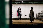 Commuters wait on a subway platform in the Brooklyn borough of New York on April 22.