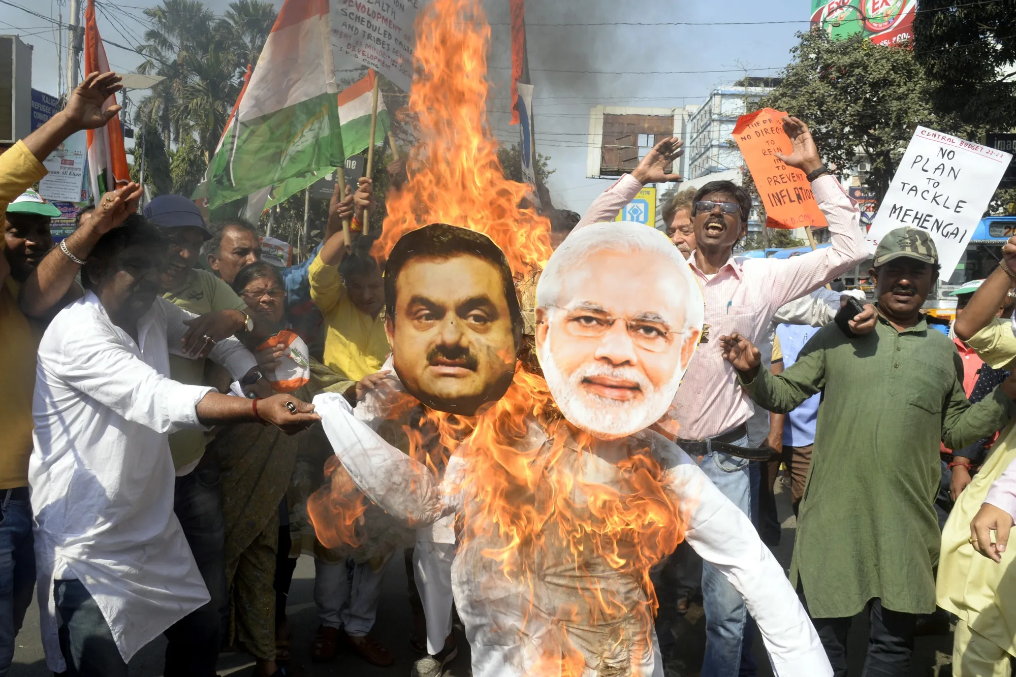 Protesters burn effigies of billionaire Gautam Adani and Indian Prime Minister Narendra Modi during a&nbsp;protest in Kolkata on Feb.&nbsp;6.