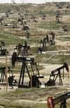 Pump units pumping heavy oil from some of the 9295 wells producing a total of over 75 000 barrels of oil per day, at the Chevron Kern River oil field in Bakersfield, California.