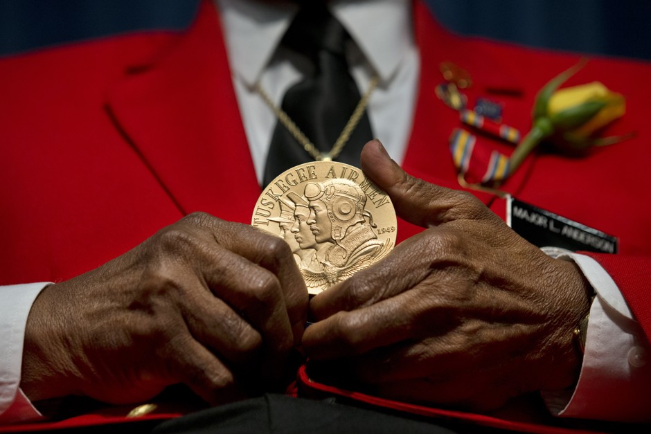 Major L. Anderson, an original Tuskegee Airman, displays his Congressional Gold Medal in 2013. Black servicemen were often targets of discrimination and violence on their return home from wartime.  